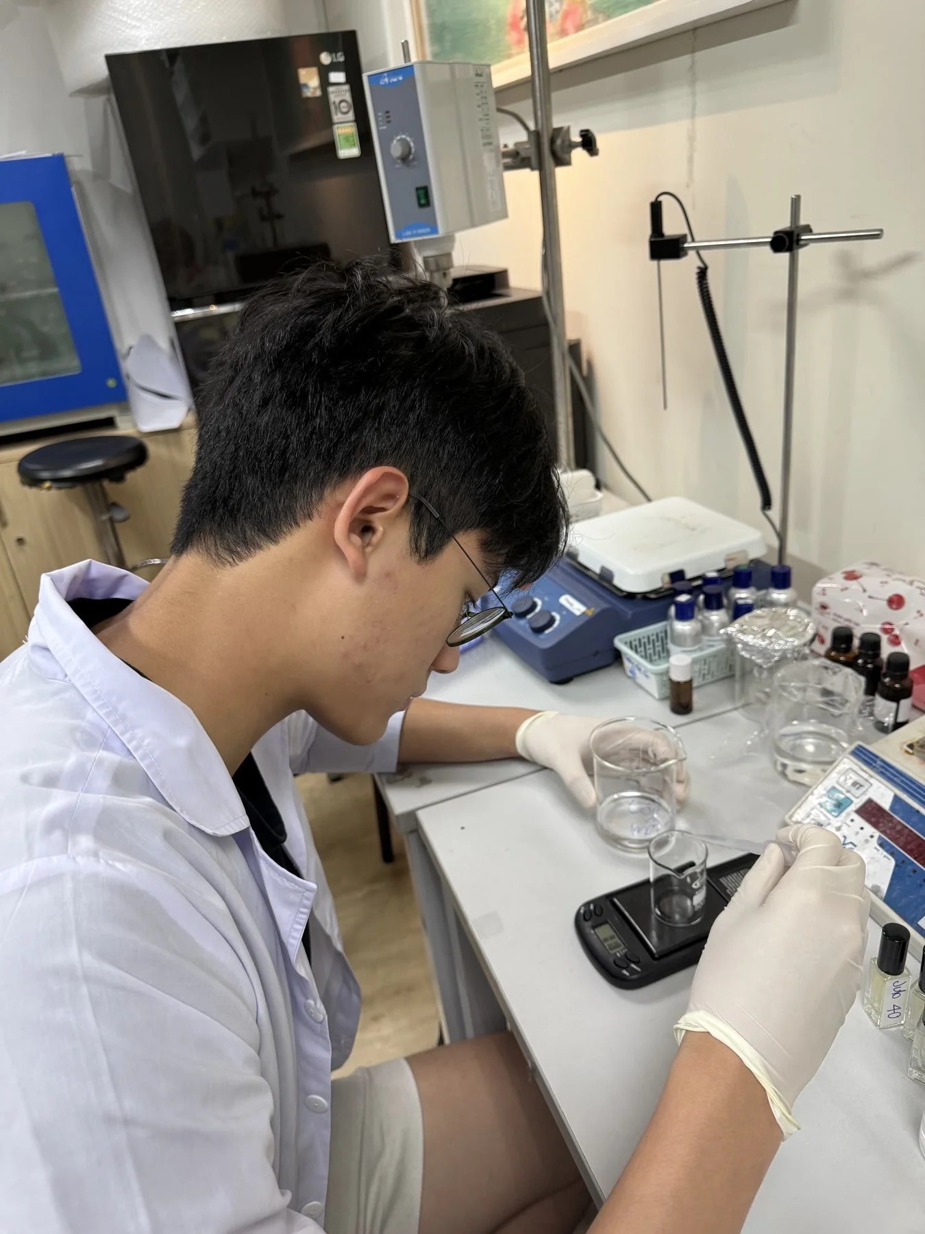 The Anh testing incense formulas in the lab