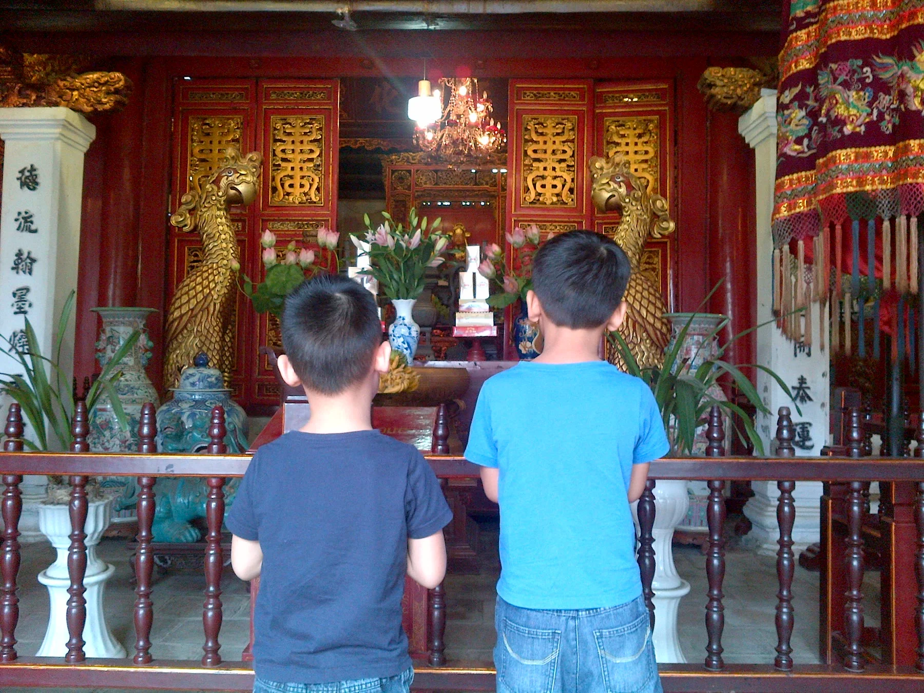 The Anh praying at the family pagoda, age 13